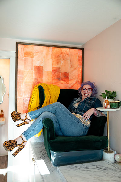 Julia Carpenter lounging in chair at Calamity Jane's Nail Studio in Medford, Oregon